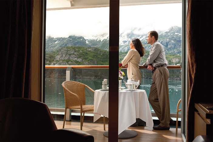 Watching the ship sail by the balcony