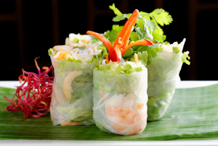 Vietnamese salad rolls with shrimps, chicken, herbs, green papaya