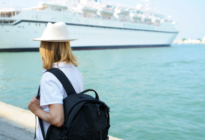 Woman watching ship on disembarkation day | Cruise1st Australia
