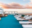 White lounge chairs placed on a blue carpet