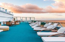 White lounge chairs placed on a blue carpet