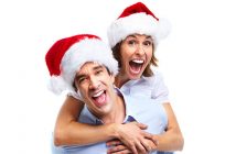 A man and a lady in festive hats