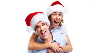 A man and a lady in festive hats