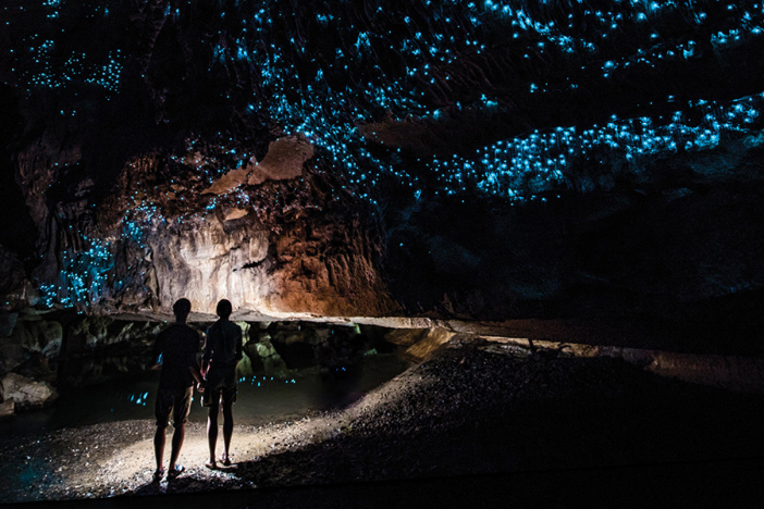 couple in cave with glowing lights