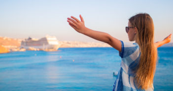 girl looking at cruise ship